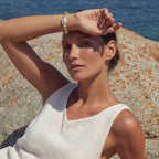 Woman wearing the spiral dreams bracelet outdoors