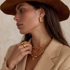 Model wearing Wave Flow Hoop Earrings - Gold Ruffled Texture