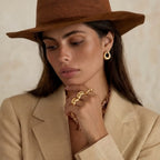 Model wearing Golden Loop Studs