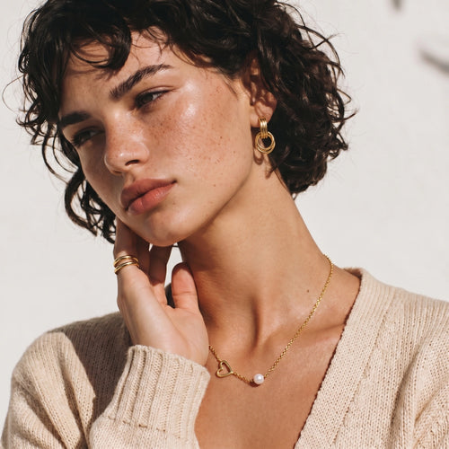 Model wearing Linear Loop Drops