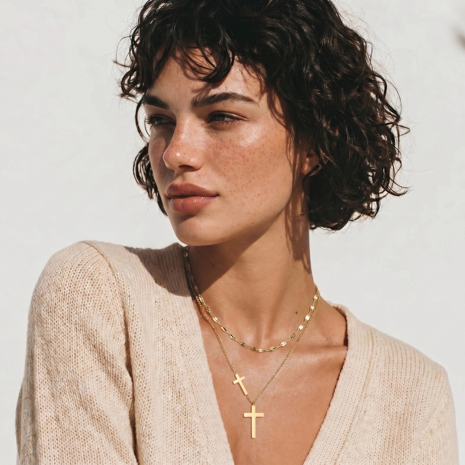 Model wearing Divine Layers Cross Necklace Set