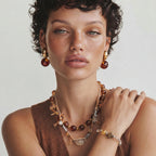 Woman wearing the golden manifest bracelet on her wrist
