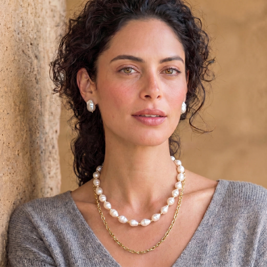 Woman wearing the golden pearl layers necklace outdoors