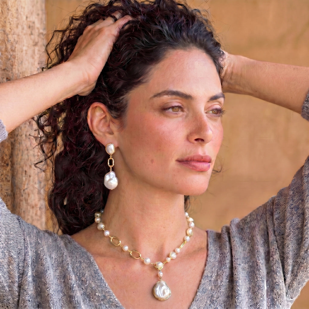 Woman wearing the lumina pearl station necklace, portrait view