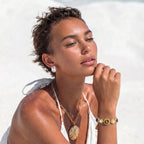 Woman wearing the tiger's eye pearl wisdom bracelet on her wrist