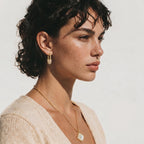 Model wearing Golden Glow Huggie Hoops