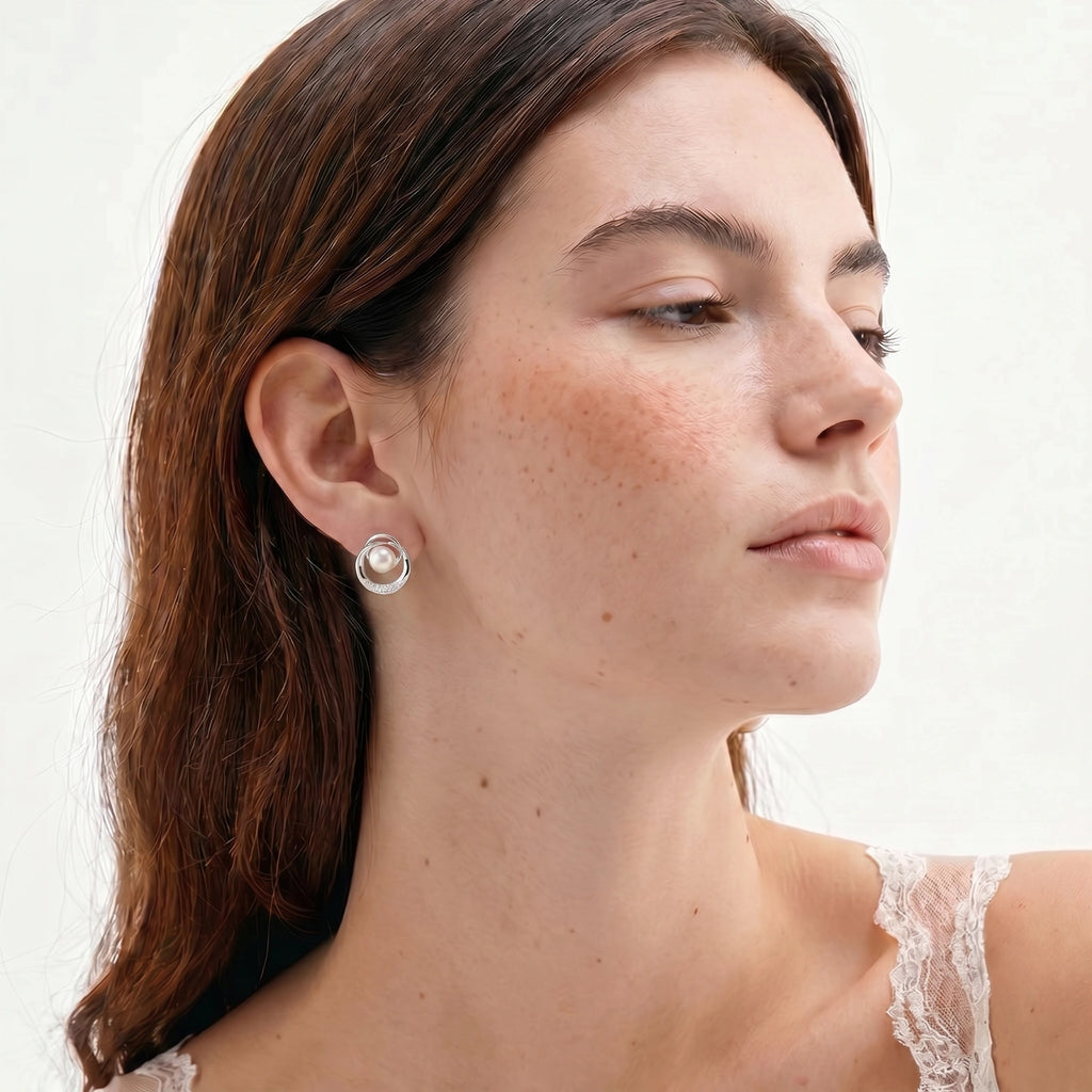 Model wearing Pearl Orbit Studs