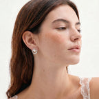 Model wearing Pearl Orbit Studs