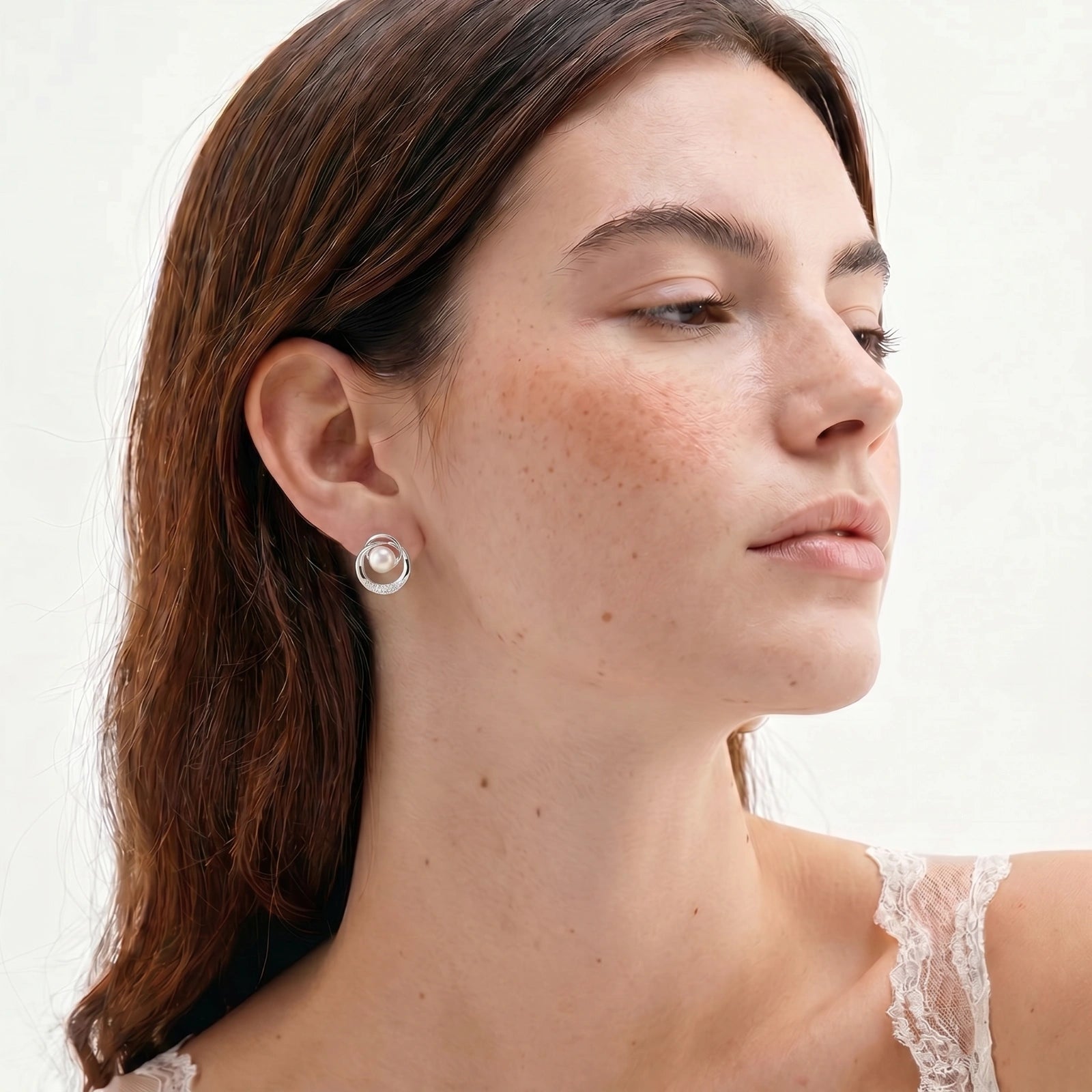 Model wearing Pearl Orbit Studs