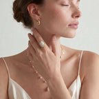 Model wearing Baroque Pearl Crown Ring - Garden Crown Glow with layered pearl jewelry
