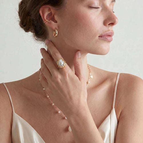 Model wearing Baroque Pearl Crown Ring - Garden Crown Glow with layered pearl jewelry