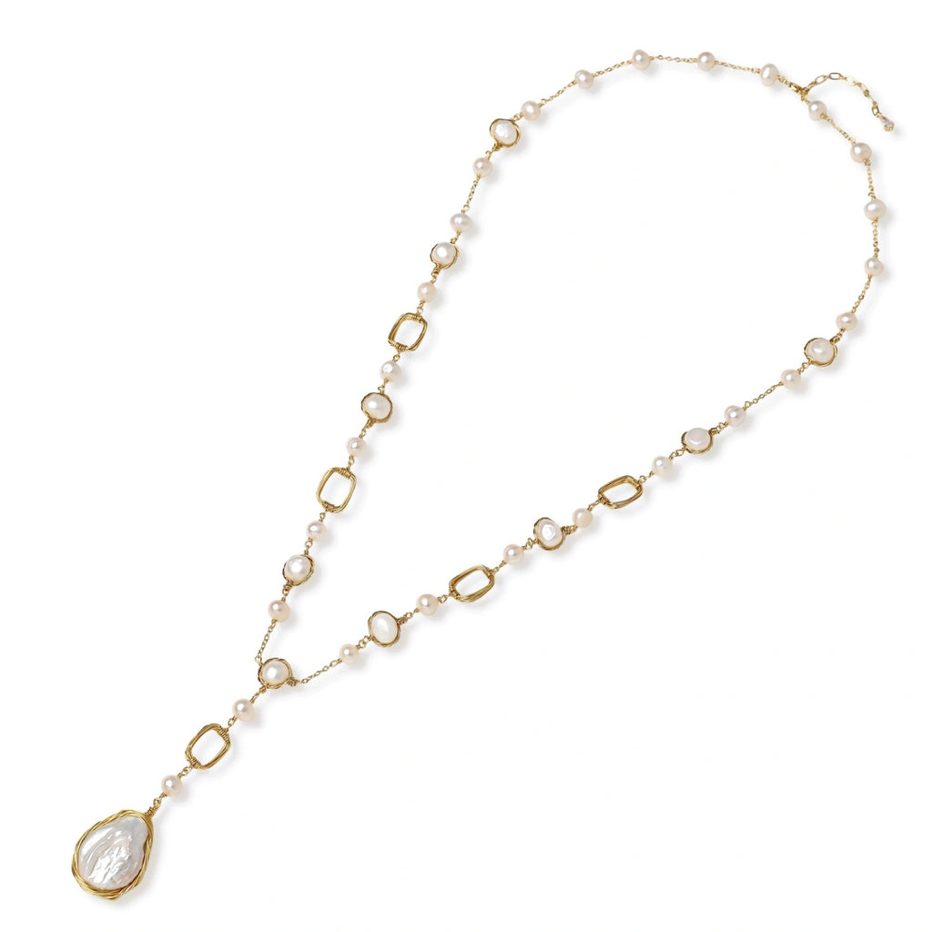 Detail view of the baroque pearl pendant on the lumina station necklace