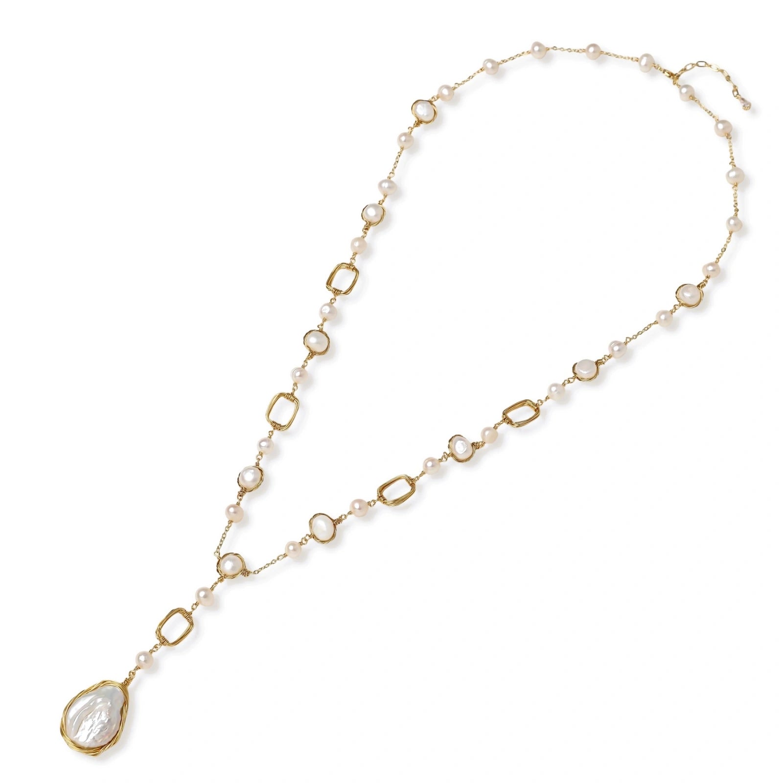 Detail view of the baroque pearl pendant on the lumina station necklace