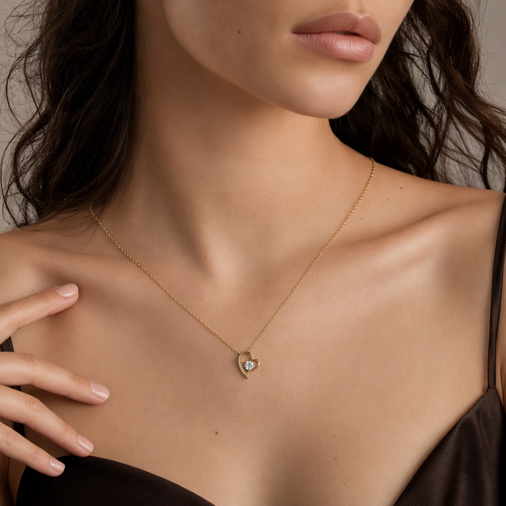 Close-up of the gold open heart cubic zirconia necklace