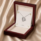 White gold forever love necklace displayed in a mahogany LED luxury gift box