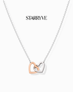 Two-tone rose and white gold interlocking hearts necklace with cubic zirconia
