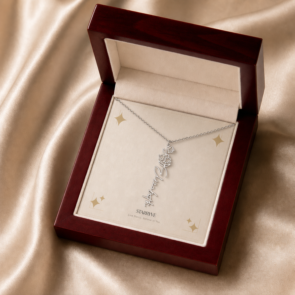 Silver flower name necklace with the May lily of the valley birth flower, shown in a mahogany LED luxury gift box