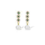 Close-up of the green cubic zirconia and pearl drop earrings