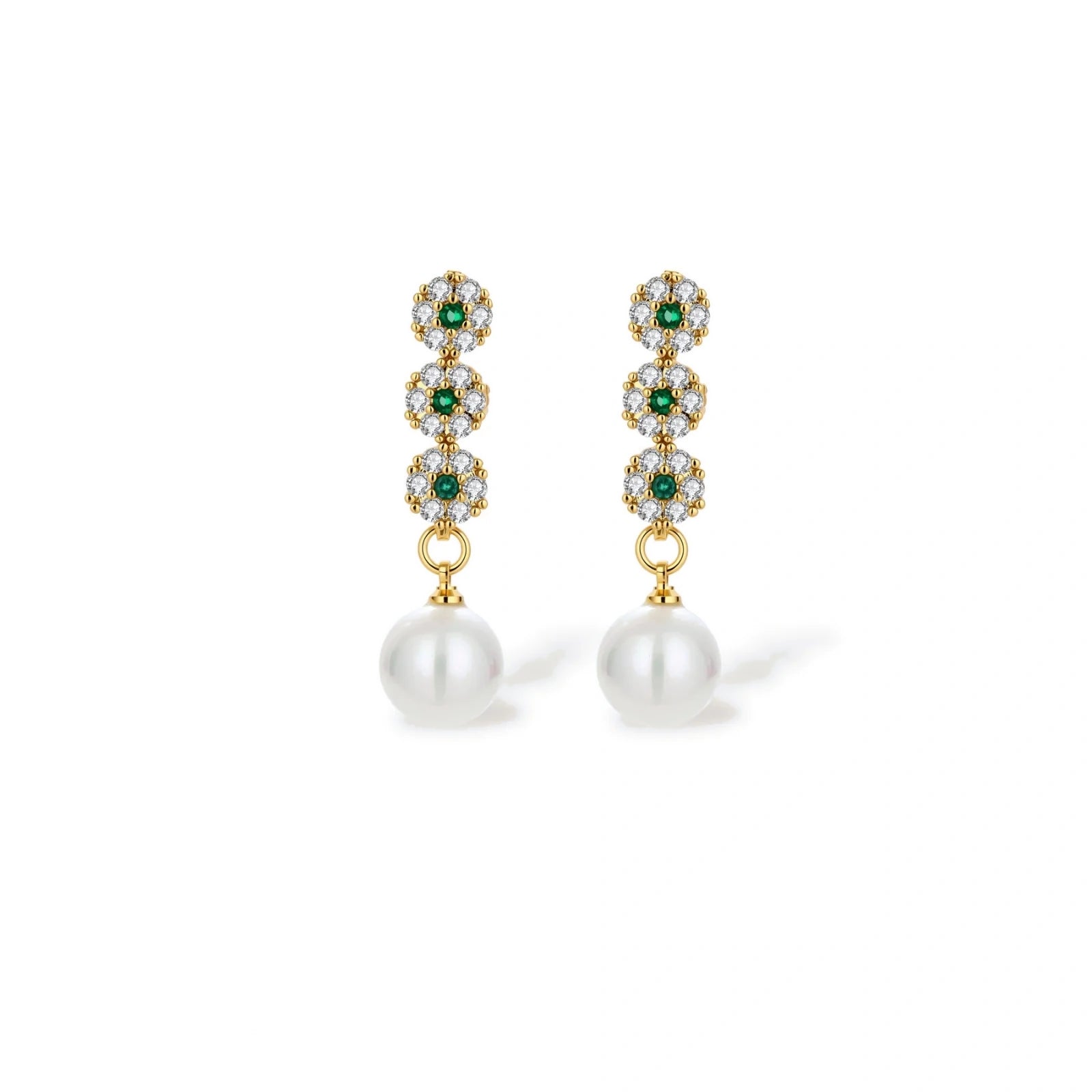 Close-up of the green cubic zirconia and pearl drop earrings