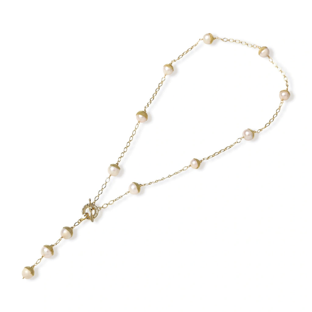 Flat lay showing the Y-drop shape of the baroque pearl station lariat