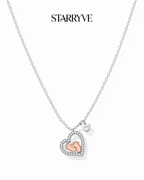 Sterling silver heart necklace with rose gold baby feet and a cubic zirconia border