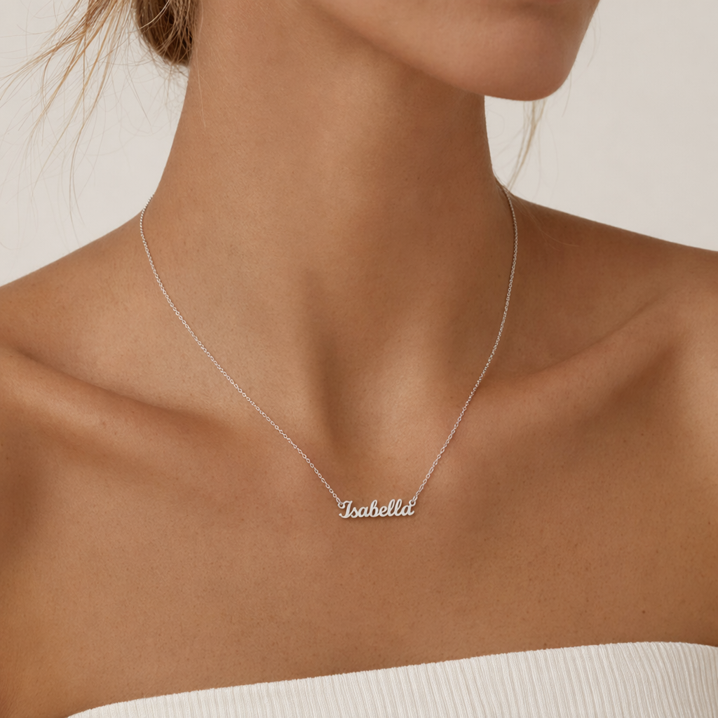 Woman wearing the silver custom name necklace with a light top