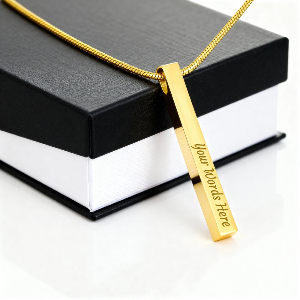 Personalized gold bar necklace engraved "Your Words Here" on a gift box