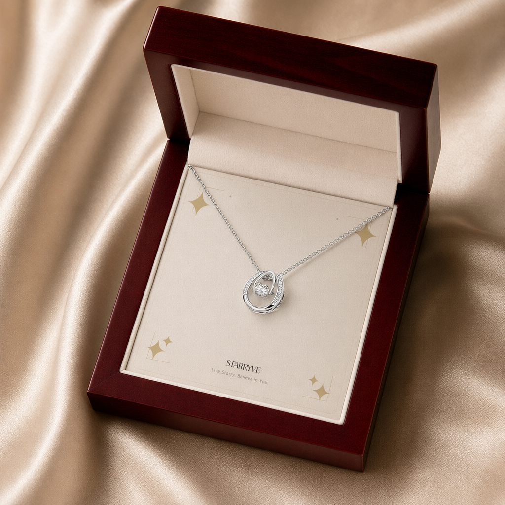 White gold lucky in love necklace displayed in a mahogany LED luxury gift box