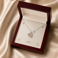 Baby feet heart necklace displayed in a mahogany LED luxury gift box