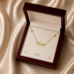 Gold custom name necklace displayed in a mahogany LED luxury gift box