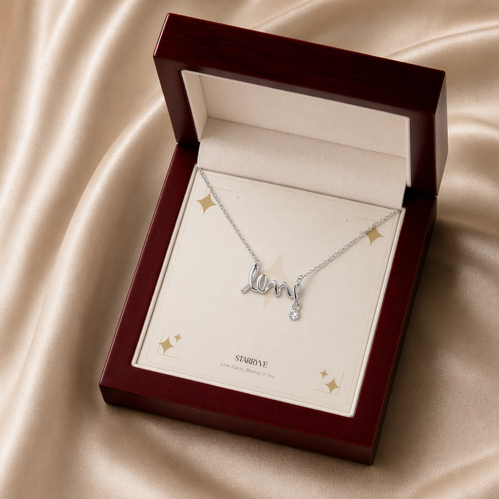 Silver scripted love necklace displayed in a mahogany LED luxury gift box
