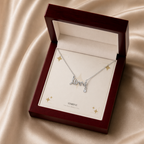 Silver scripted love necklace displayed in a mahogany LED luxury gift box
