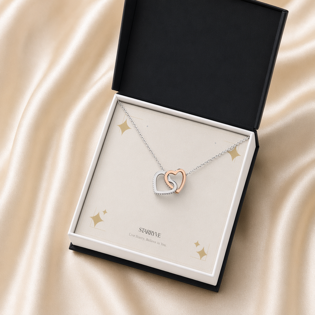 Rose and white gold interlocking hearts necklace in a black standard gift box