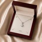 White gold eternal hope necklace displayed in a mahogany LED luxury gift box