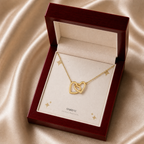 Gold interlocking hearts necklace in a mahogany LED luxury gift box