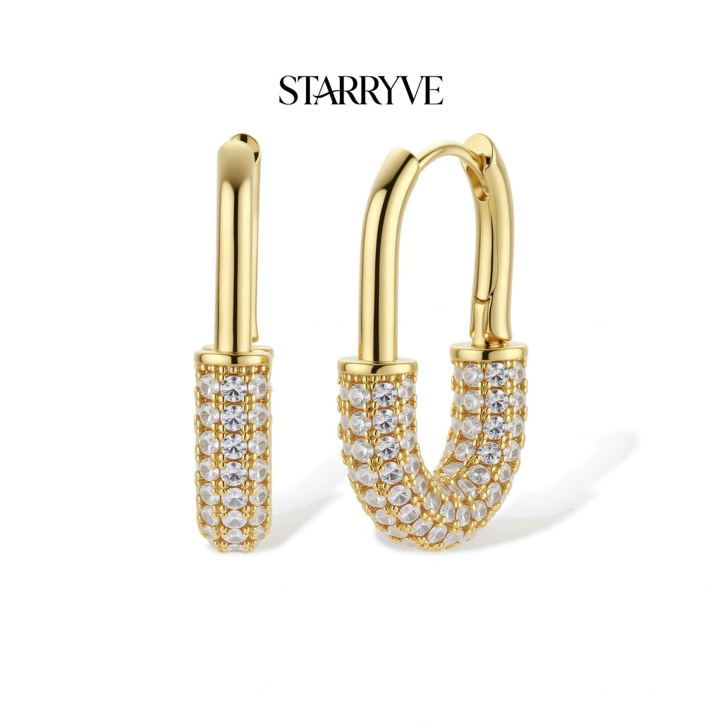 Golden Glow Huggie Hoops with STARRYVE logo