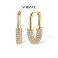 Golden Glow Huggie Hoops with STARRYVE logo